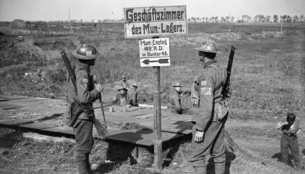 216_Canadian Soldiers trying to read German signposts. Advance East of Arras. October, 1918